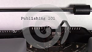 The words `Publishing 101 ` being typed on a typewriter