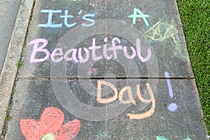 The words "It's a beautiful day" motivational phrase
