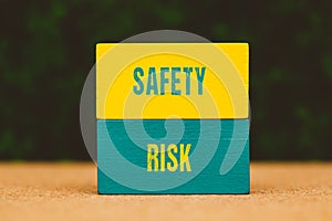 the words safety , risk written on colorful wooden cubes - Business concept