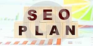 Words seo plan made with letters on wooden cubes on desk