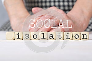 Words SOCIAL ISOLATION composed of wooden made dices