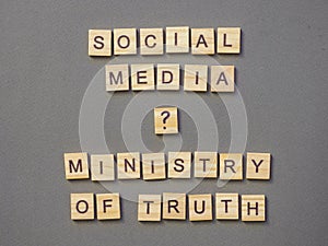 Words social media ministry of truth on gray background.