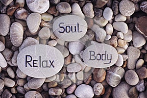 Words Soul, Body and Relax written on stones