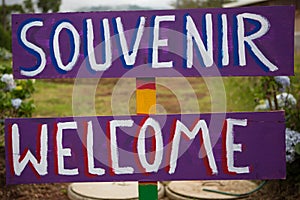 Words Souvenir and welcome sign