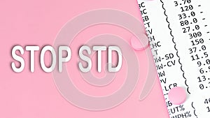 Words STOP STD Sexually transmitted diseases on pink background, medical concept, top view