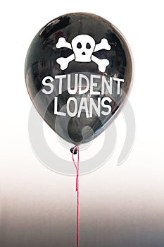 The words student loans in white and a skull and cross bones on a balloon illustrating the concept of a debt bubble