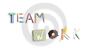 The words team work created from office stationery.