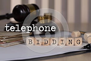 Words TELEPHONE BIDDING composed of wooden dices