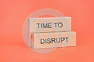 Words Time to disrupt on wooden blocks
