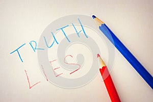 Words truth and lies are written on paper