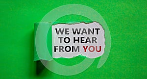 The words `we want to hear from you` appearing behind torn green paper. Beautiful background. Business concept photo