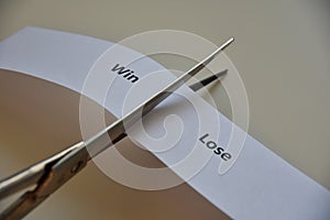 Words `WIN or LOSE` on paper background