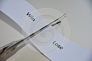 Words `WIN or LOSE` on paper background
