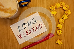 Word writing text Long Weekend. Business concept for Short vacation Holiday season Relaxing Recreation timeIdeas on paper red pen photo