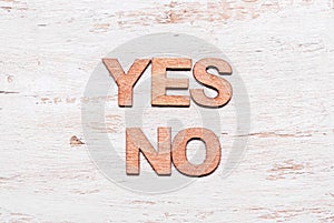 Words yes no in wooden letters