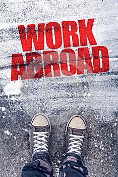 Work abroad title on the pavement