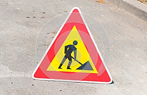 Work ahead caution or warning traffic road sign on the street