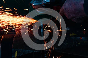 work as a grinder, metal cutting, sparks from metal cutting