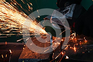 work as a grinder, metal cutting, sparks from metal cutting