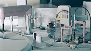 Work of the biochemical analyzer in the laboratory close up. test tubes that are automatically sent for examination