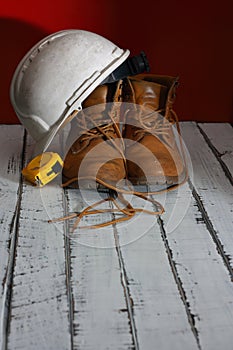 Work boots, with white helmet and yellow meter