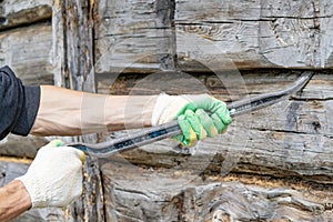 Work breaks the old building with a tire iron