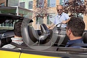 Work colleagues car pooling from the office