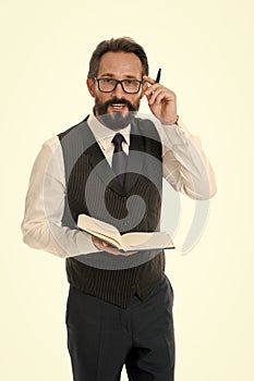 Work concept. Bearded man in glasses focus on paper work. Businessman have busy day at work. Hard work ensures success