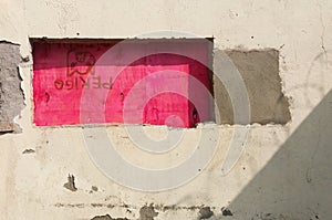 work: concrete wall and window with pink siding