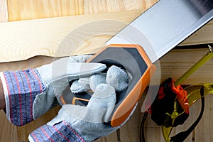 Work on the construction or repair of the house. Renovation. Use saw work gloves tape measure. Concept DIY workplace safety
