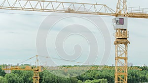 The work of a crane at a construction site. Time Lapse