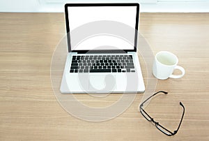 Work desk interior with a blank screen and blank keyboard of lap