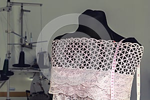 Work dummy on the background of sewing machines in workshop