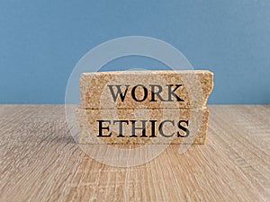 Work ethics symbol. Concept words Work ethics on brick blocks.