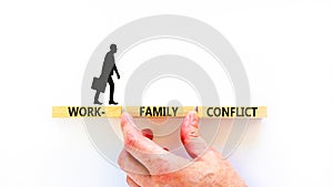 Work-family conflict symbol. Concept words Work-family conflict on wooden block on a beautiful white table white background.