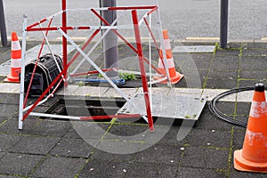 Work Fibre optic cable in city street digital Fiber Internet connection cables crossing