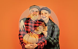 Work at fields. Harvest festival. Farmers market. Autumn mood. Couple in love checkered rustic outfit. Retro style. Fall
