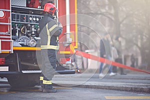 Work of firefighters. Firefighter with uniform and helmet