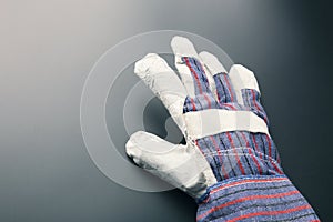 Work glove against grey