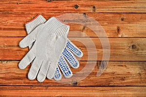 Work gloves on wooden background. Copy space.