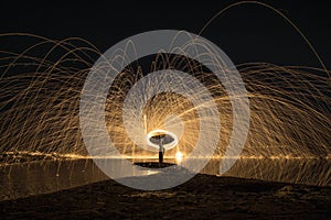 work of glowing sparks from spinning steel wool by human.