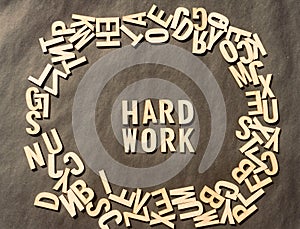 Work Hard Word In Wooden Cube Alphabet Letters Top View On A rustic paper Background