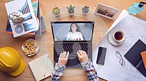 Work from home. boss making video conference to order work with employee via laptop computer during home isolation to avoid spread