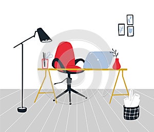Work from home concept. Organized workplace with red swivel chair, desk with laptop, modern stanging lamp and paper photo