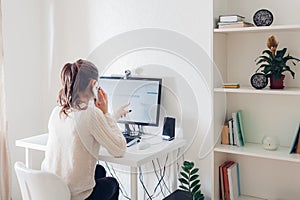 Work from home during coromavirus pandemic. Woman stays home. Workspace of freelancer. Office interior with computer