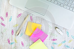 Work From Home Desk With Laptop Computer and Post It Notes