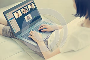 Woman having video conference with colleagues in concept work from home