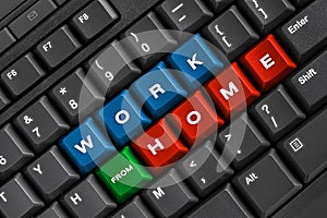 Work from home word on black keyboard, using computer online at home office