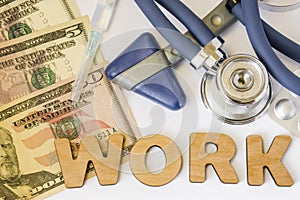 Work in hospitals, clinics, occupational medicine and pharmacy concept photo. Stethoscope, neurological hammer, dollar bills and s