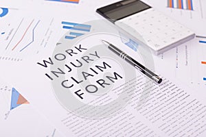 Work injury claim form concept, documents on the desktop